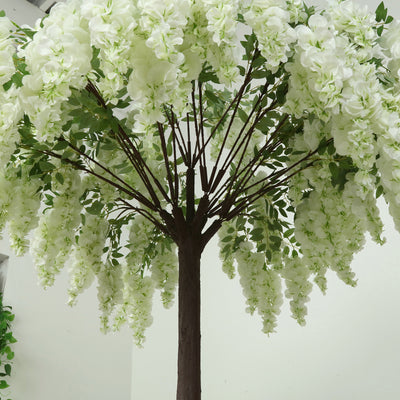 Artificial white flower tree with lush blooms and green leaves.