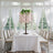 Elegant floral tree centerpiece for weddings or events in a bright, airy setting.