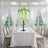 Elegant floral centerpiece on a dining table with white drapes and soft lighting.
