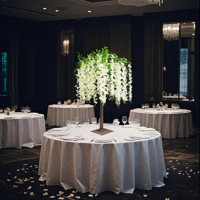 Elegant floral centerpiece on a banquet table in a sophisticated event setting.