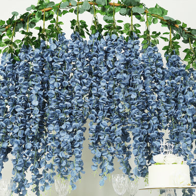 Blue floral garland with cascading petals for event decoration.