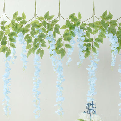 Blue floral garland with green leaves hanging decoratively
