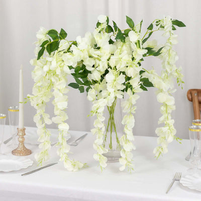 Elegant white floral arrangement in a vase for table decor.
