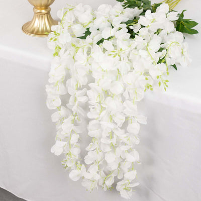 White orchid flower garland draping elegantly over a table.