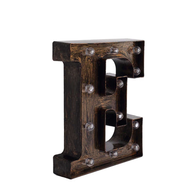 Marquee letter "E" with lights, rustic finish, studio shot.