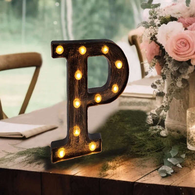 Decorative illuminated letter 'P' for events or home decor.