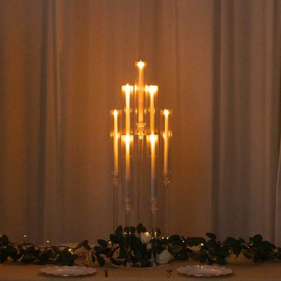 Elegant candle holder with multiple lit candles, creating a warm ambiance.