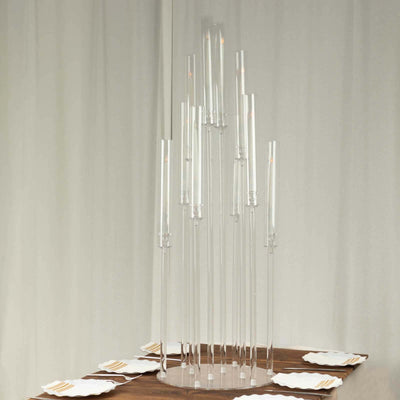 Modern clear candle holder with multiple tall tubes for elegant table decor.