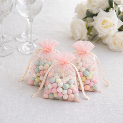 Pastel candy gift bags with tulle, perfect for wedding favors and party treats