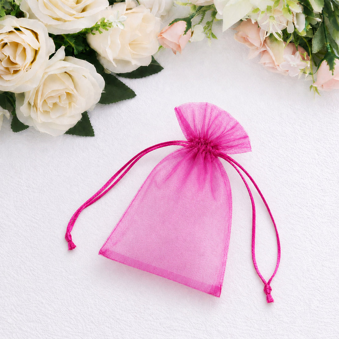 Pink sheer organza drawstring gift pouch with satin ribbons
