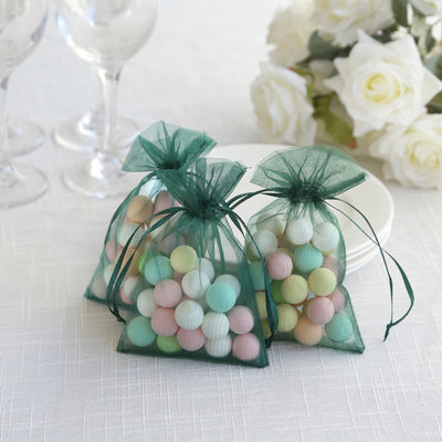 Colorful decorative candy bags with pastel balls on a table.
