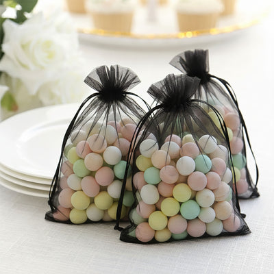 Colorful candy-filled mesh bags for party favors.