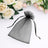 Black organza gift bag with drawstring closure on a floral background.