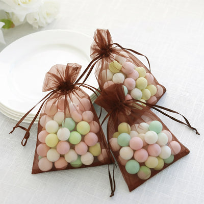 Pastel candy-filled organza bags for festive occasions.