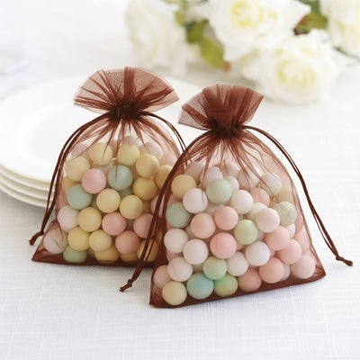 Pastel-colored candy-filled organza bags for party favors