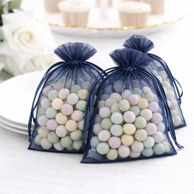 Pastel candy-filled organza bags for party favors or events.