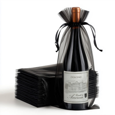 Dolcino wine bottle elegantly wrapped in black tulle with ribbons
