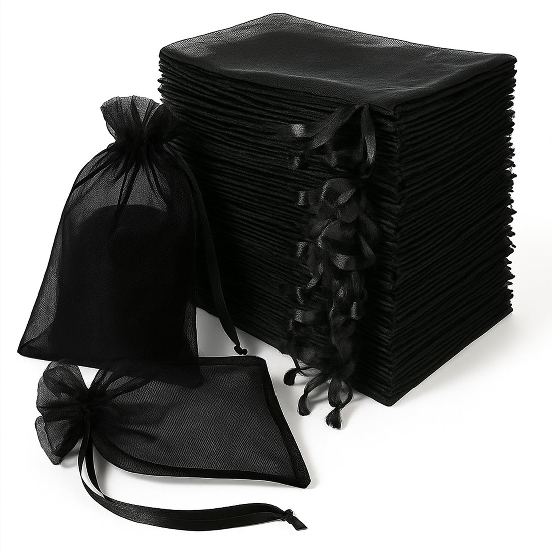 Black organza gift bags stacked and arranged in various sizes.