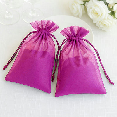Two purple organza gift bags on a white background.