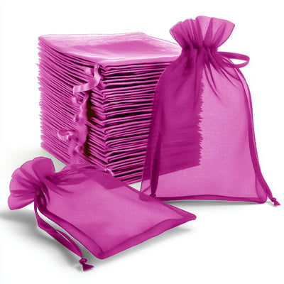 Purple organza gift bags stacked and displayed against a plain background.