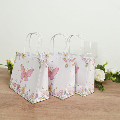 Decorative butterfly gift bags with floral design.