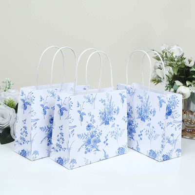 Floral design gift bags in blue and white, elegantly arranged.