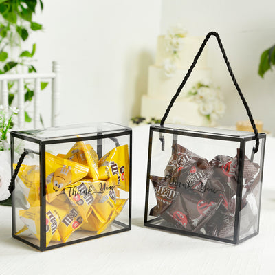 Two clear gift boxes filled with yellow and brown candies, labeled \"Thank You\".