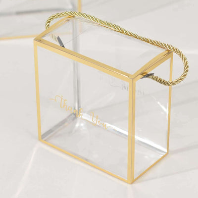 Clear acrylic gift box with gold accents and "Thank You" text.