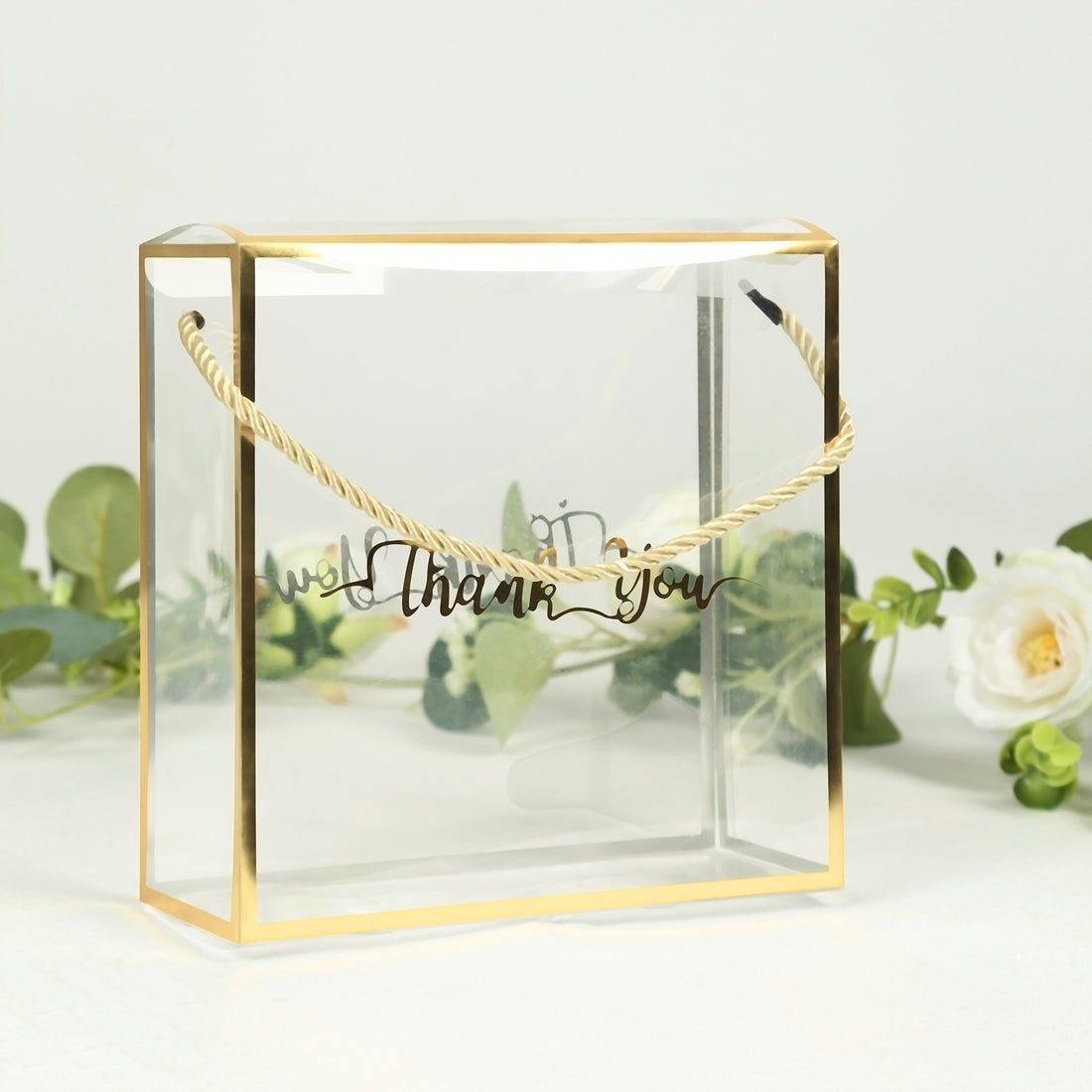 Clear gift box with gold accents and "Thank You" lettering.