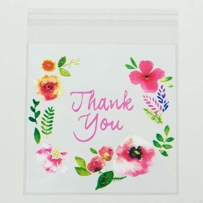 Thank You floral card with pink and yellow flowers on a white background.