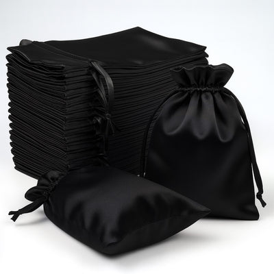 Set of black satin drawstring bags on a white background.