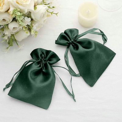 Green satin drawstring bags for gifts or favors.