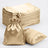 Set of gold satin drawstring bags on a plain background.