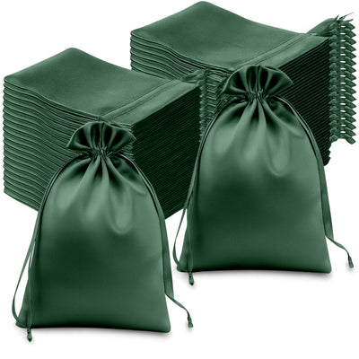 Green satin drawstring bags in a stack, ideal for gifts or organization.