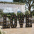 Outdoor wedding reception with illuminated LOVE sign and floral canopy