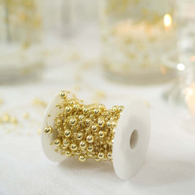 Gold decorative beading on a spool for crafts and DIY projects.