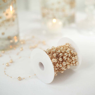 Gold bead garland on a spool for decorative use.