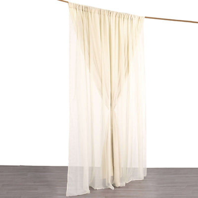 Sheer cream curtain hanging from a rod against a white background.