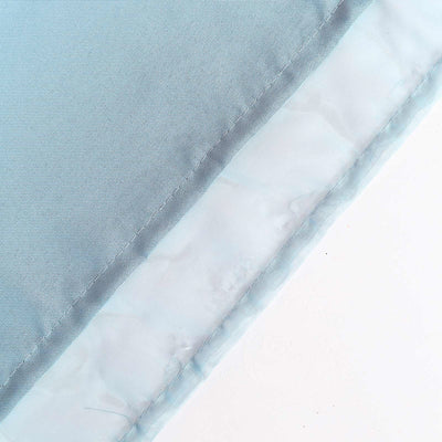 Light blue fabric edge with a smooth finish and delicate stitching details.