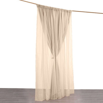 Sheer beige curtain hanging on a rod against a white background