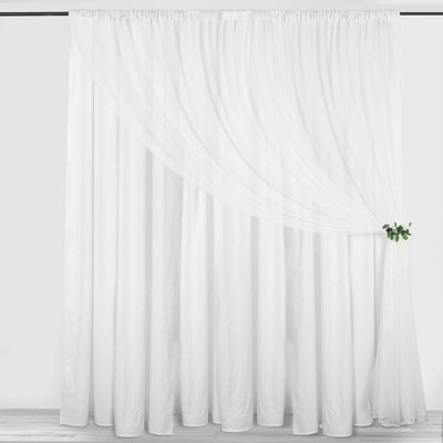 White sheer curtain draped elegantly with a decorative green accent