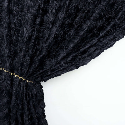 Black rose-patterned fabric with flowing drape detail.