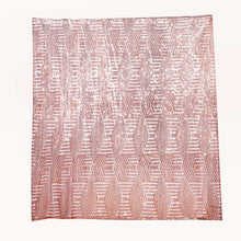 a piece of paper with shiny sequin beads on mesh base with satin backing in rose gold color and diamond pattern