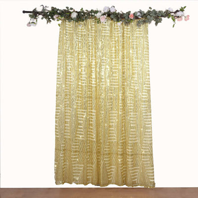 Gold patterned curtain draped elegantly with floral accents above