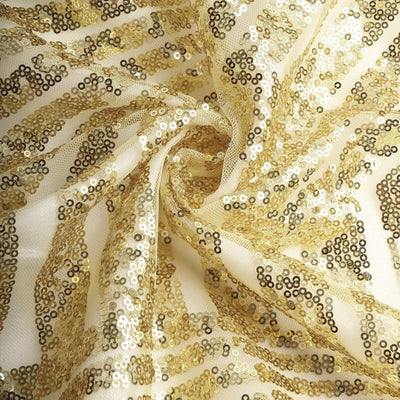 Gold sequin fabric with intricate patterns and shimmering details.