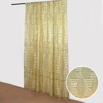 Gold patterned curtain with a decorative design, displayed in a studio shot.
