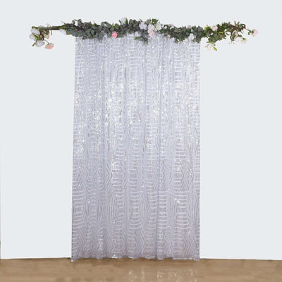 Sheer sequin curtain with floral accents, perfect for events and décor.
