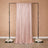 Rose gold sequin backdrop draped elegantly on a black frame with floral accents.