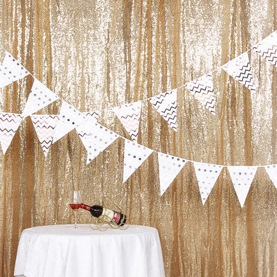 White and gold party banner with zigzag and polka dot patterns.