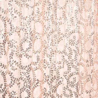 Decorative pink fabric with metallic floral pattern details.
